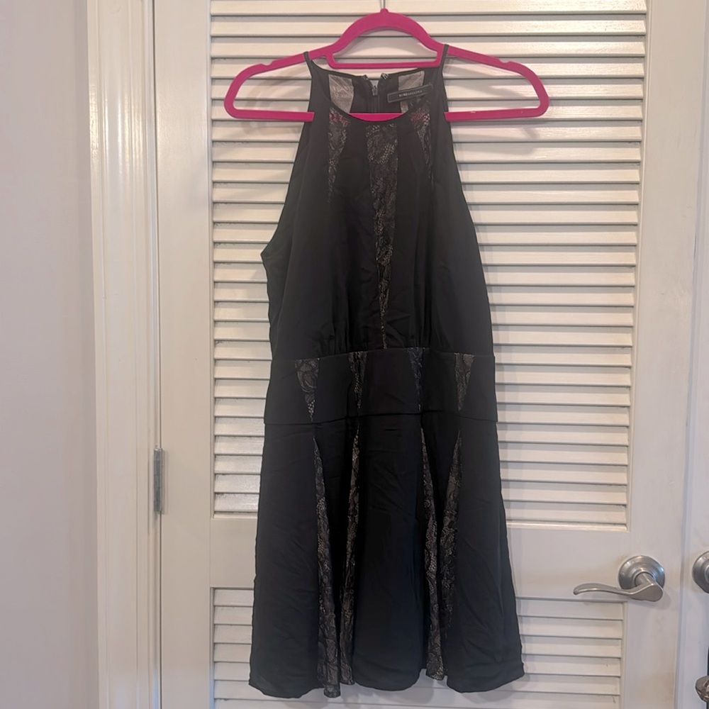 BCBG MAXAZRIA halter black dress with mesh paneling. Size 6.